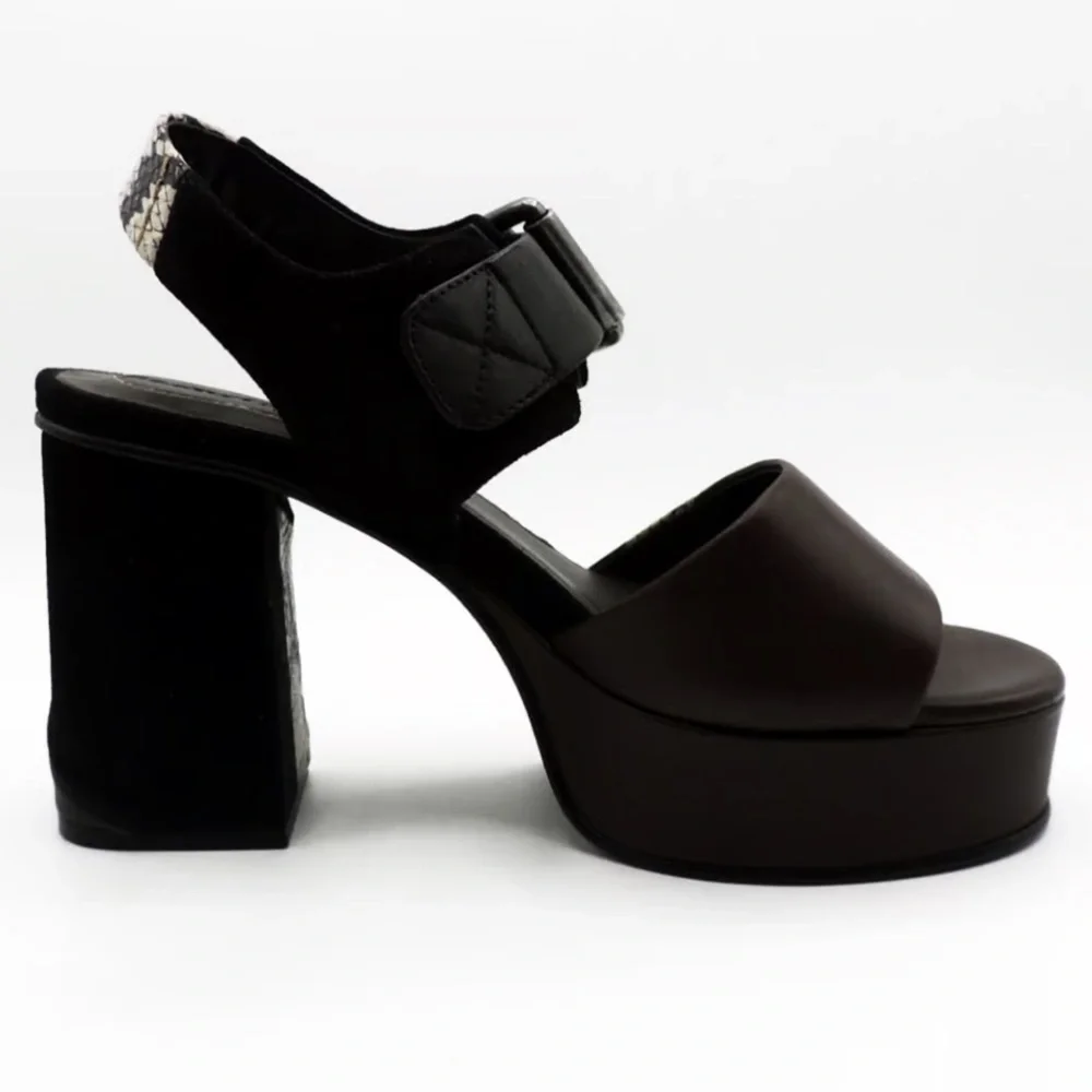 See by Chloe . Black , brown and python print platform heels.